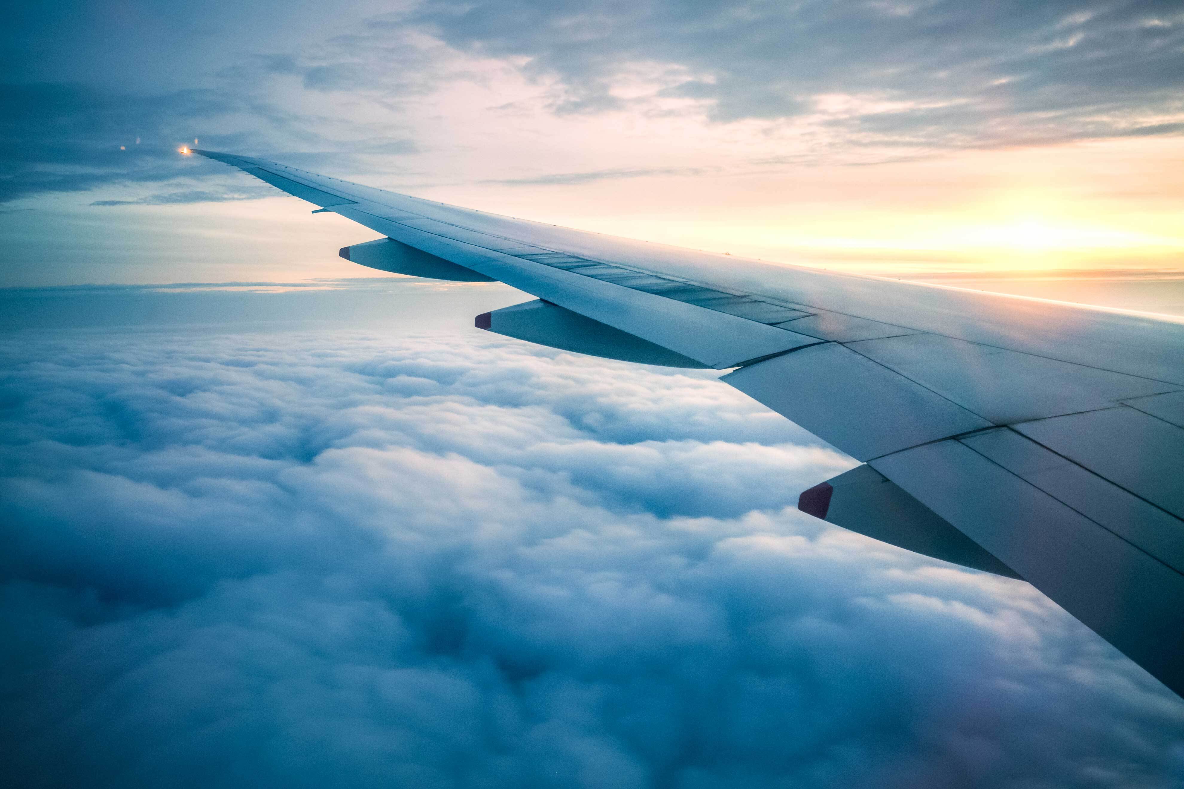 Jet wings over clouds